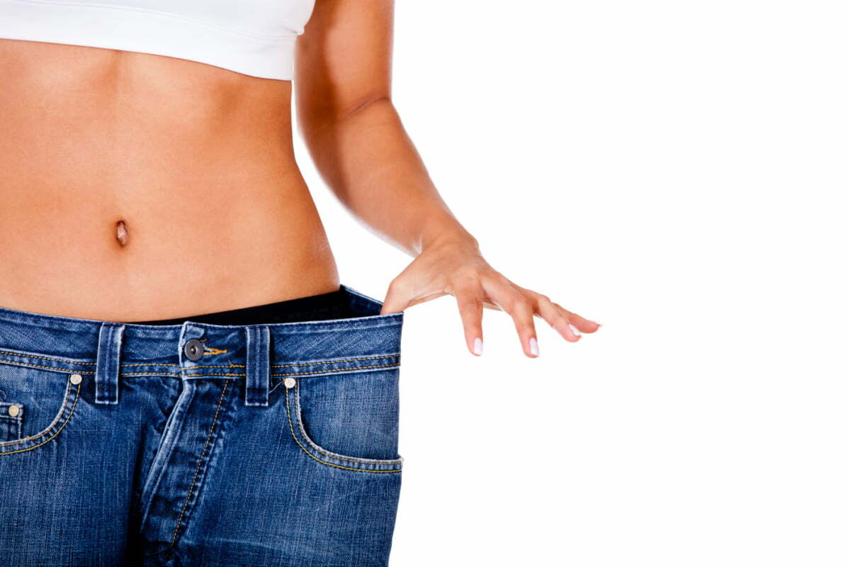 Woman in Jeans After Tummy Tuck