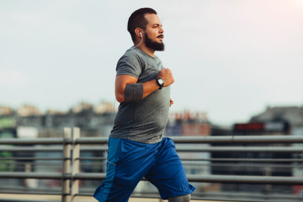 Man running after post massive weight loss body lift