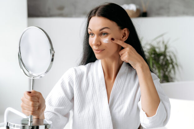 Woman applying medical-grade sun block with zinc